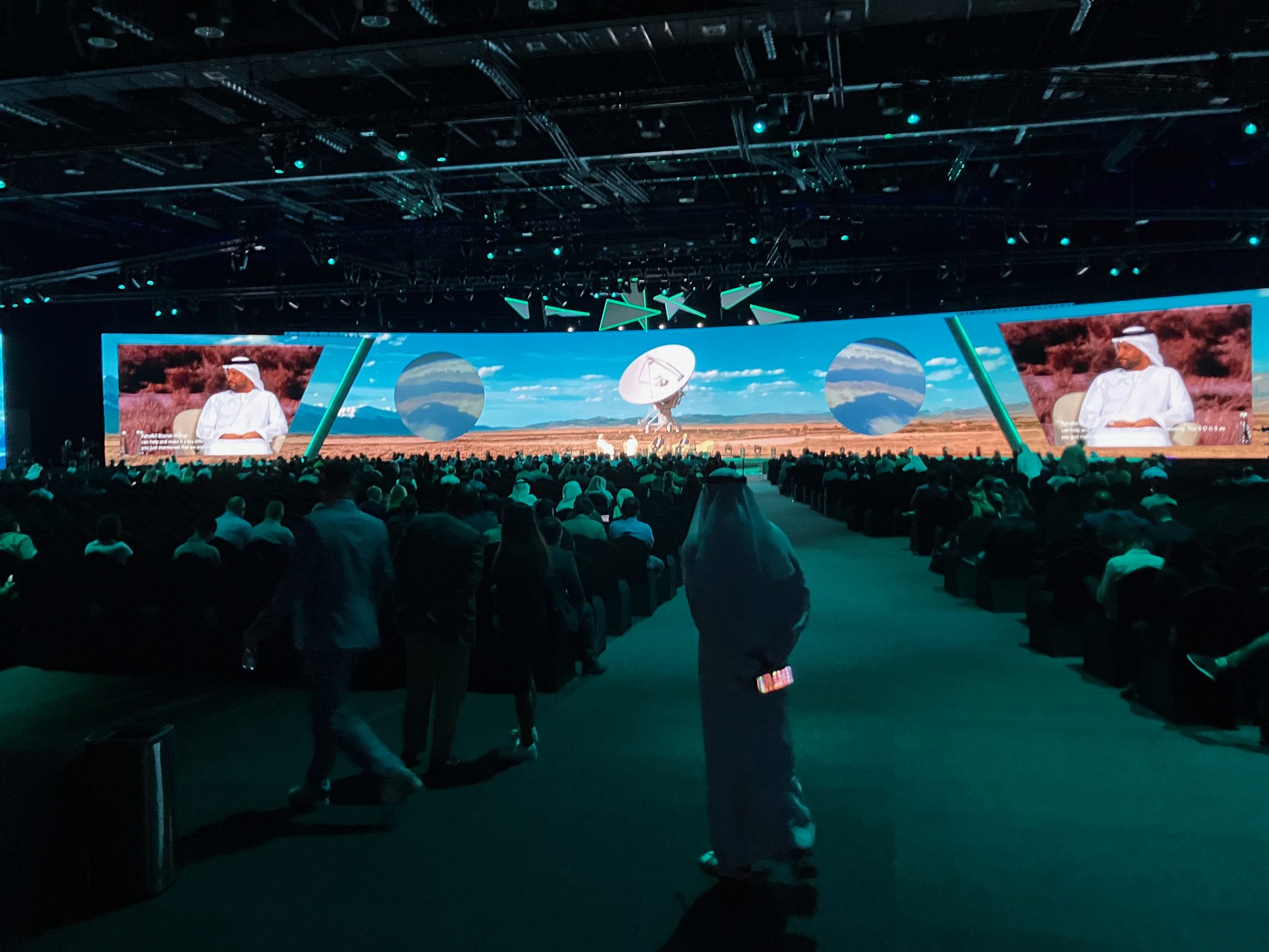 The full audience in the ADNEC hall facing a huge curved LED wall during the keynote